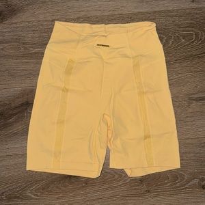 Yellow gymshark Whitney Simmons collection biker shorts